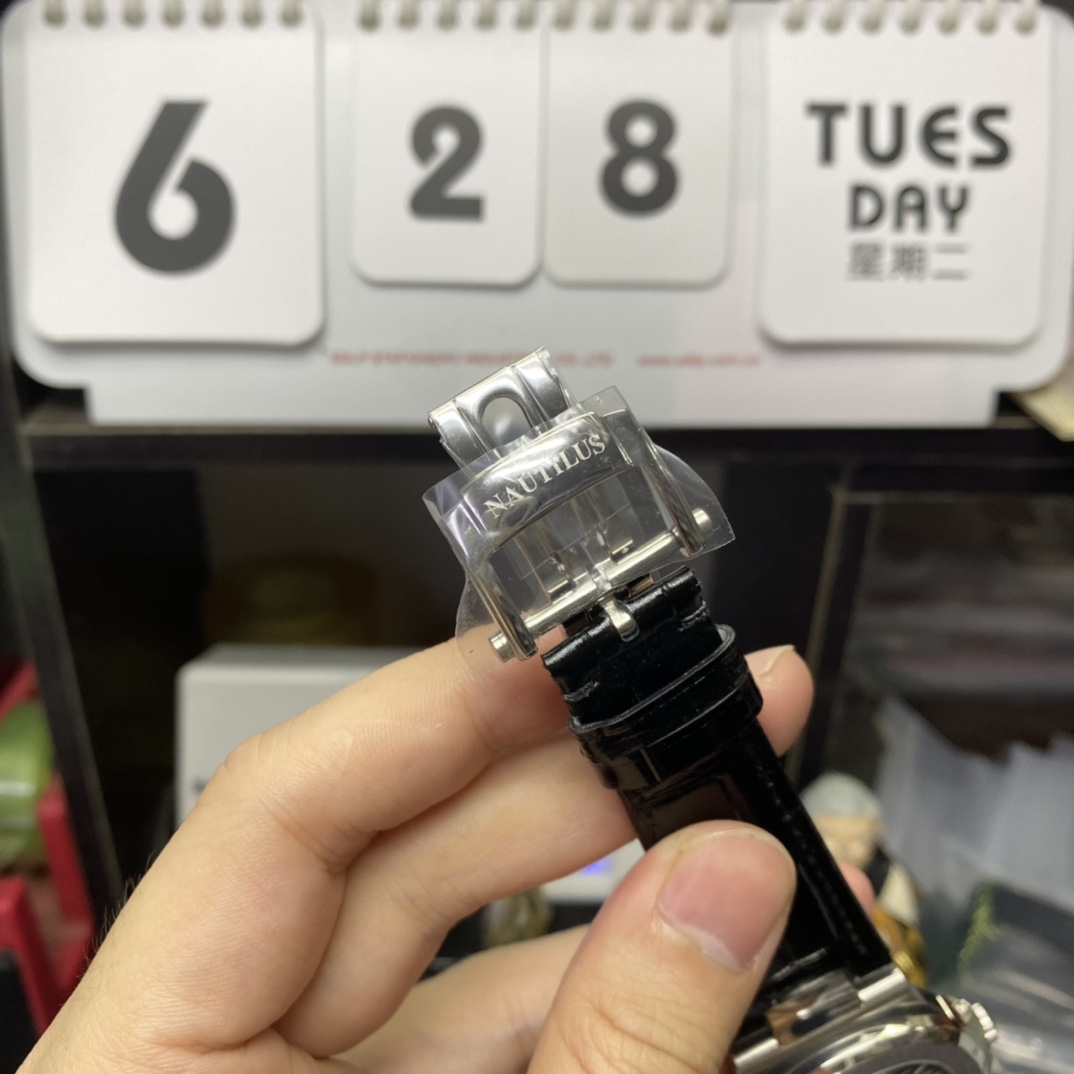 Patek Philippe Nautilus series 5712G-001, Stainless Steel Case Grey Dial Black Leather Strap, 40mm size.