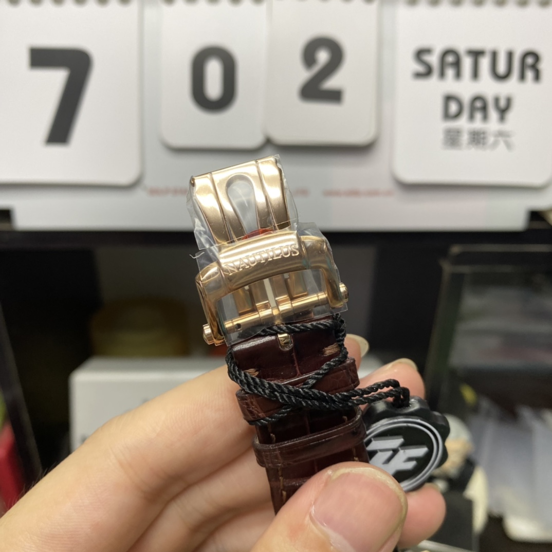 Patek Philippe Nautilus series 5712GR-001, Coffee Dial Rose Gold Case Brown Leather Strap, 40mm size.