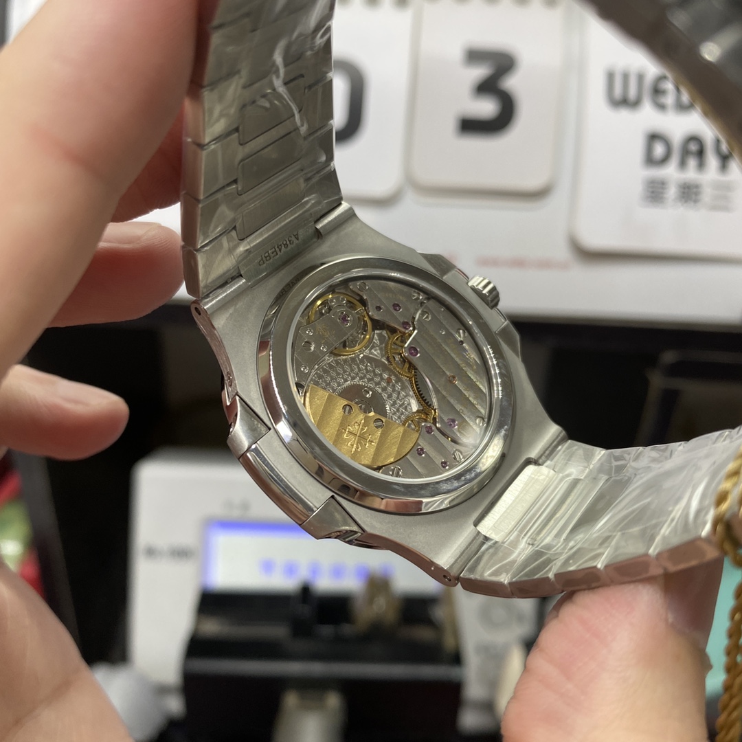 Patek Philippe Nautilus series 57121A-001, Blue Dial Steel Bracelet, Synchronized Functions, 40mm size.