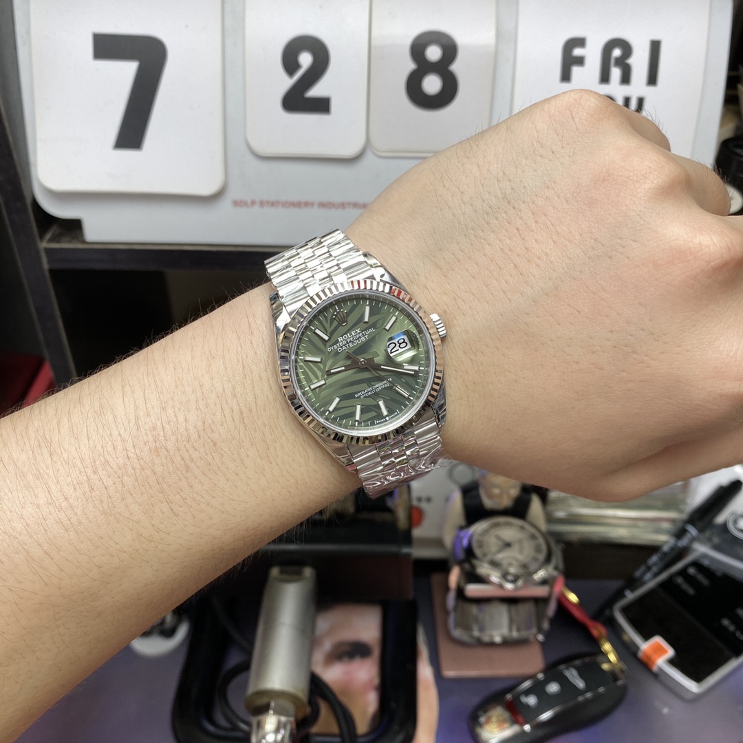 Rolex Datejust series m126234-0047, Palm Leaf Pattern on a Green Dial, 36mm size, Jubilee stainless steel bracelet.