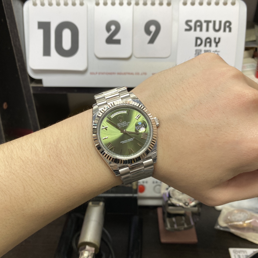 Rolex Day-Date series m228239-0033, Silver Case Olive Green Dial with Roman Numeral Markers, Instantaneous Day and Date Functions, 40mm Size.