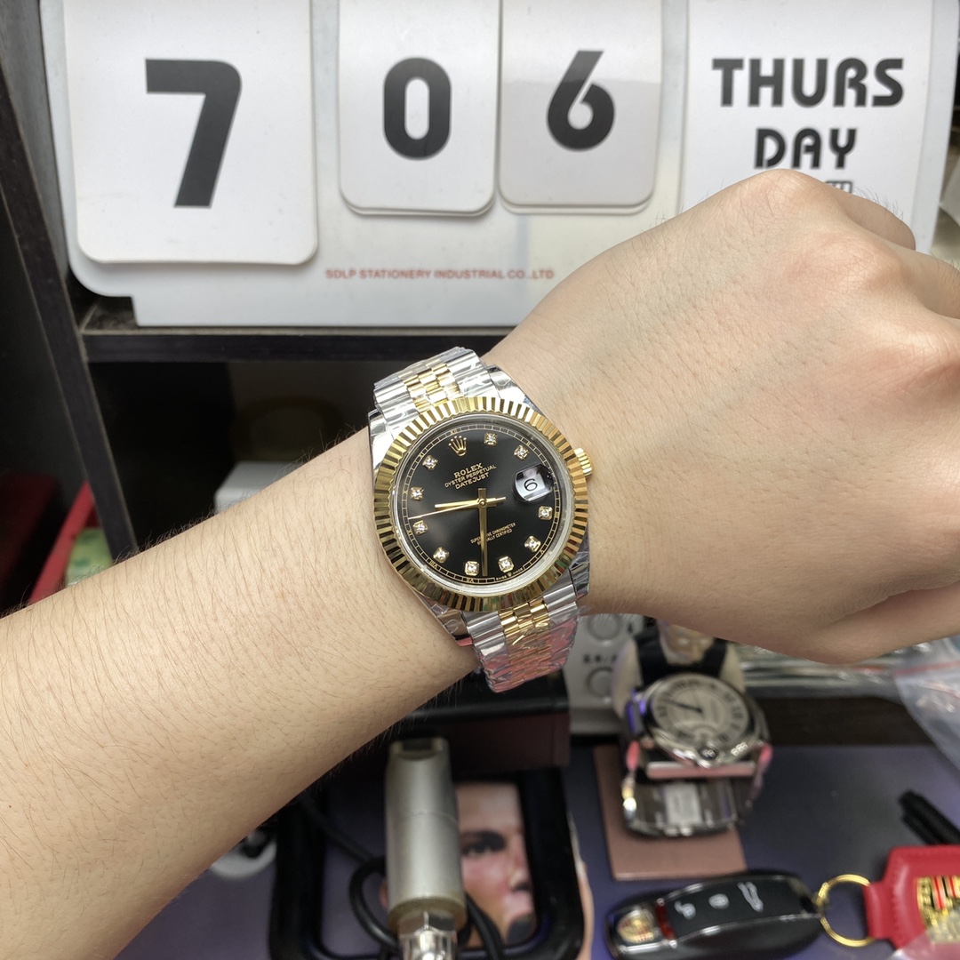 Rolex Datejust series m126333-0006, two-tone gold case black dial with diamond markers and a five-link two-tone gold bracelet, 41mm size.