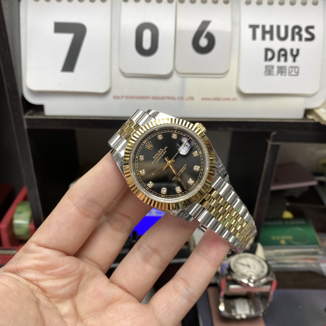 Rolex Datejust series m126333-0006, two-tone gold case black dial with diamond markers and a five-link two-tone gold bracelet, 41mm size.