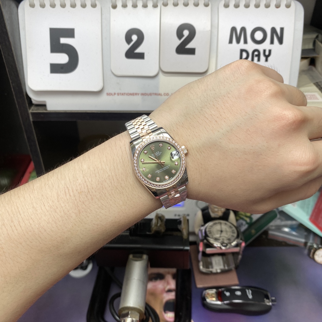 Rolex Datejust series m278383rbr-0030, Two-Tone Gold Case with Green Dial and Diamond Bezel, 31mm size, Jubilee bracelet.