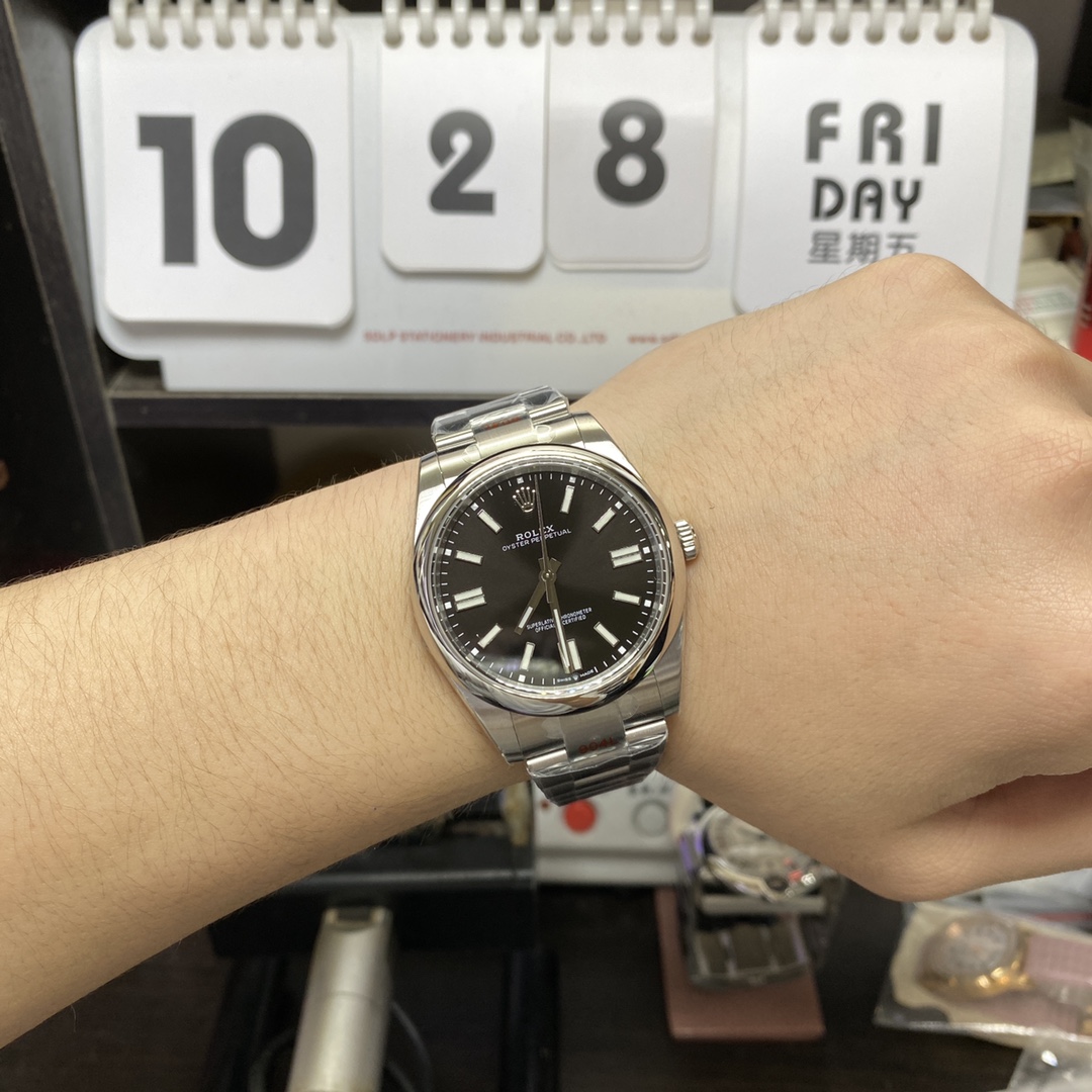 Rolex Oyster Perpetual series m124300-0002, Black Dial with Stick Indexes, 41mm size.